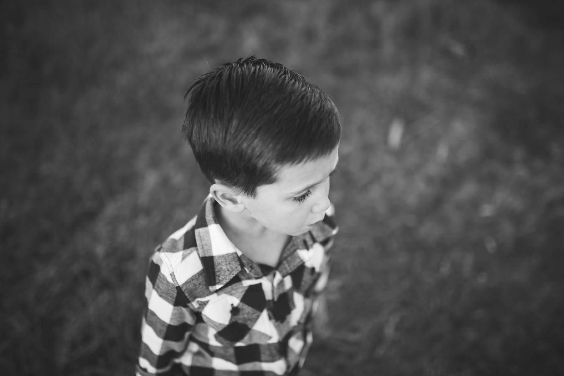 boy plays at sunset on old tree farm