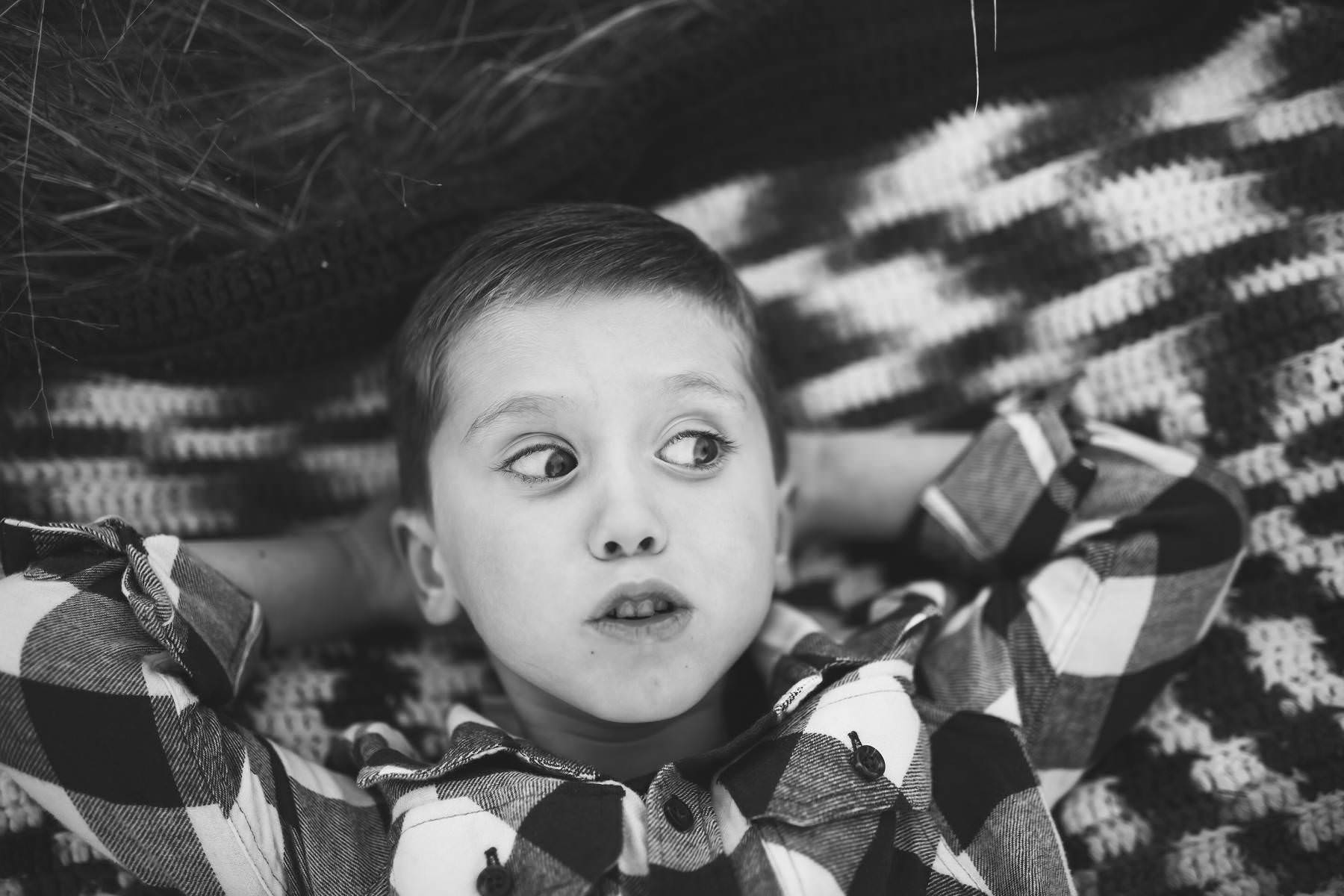 boy plays at sunset on old tree farm