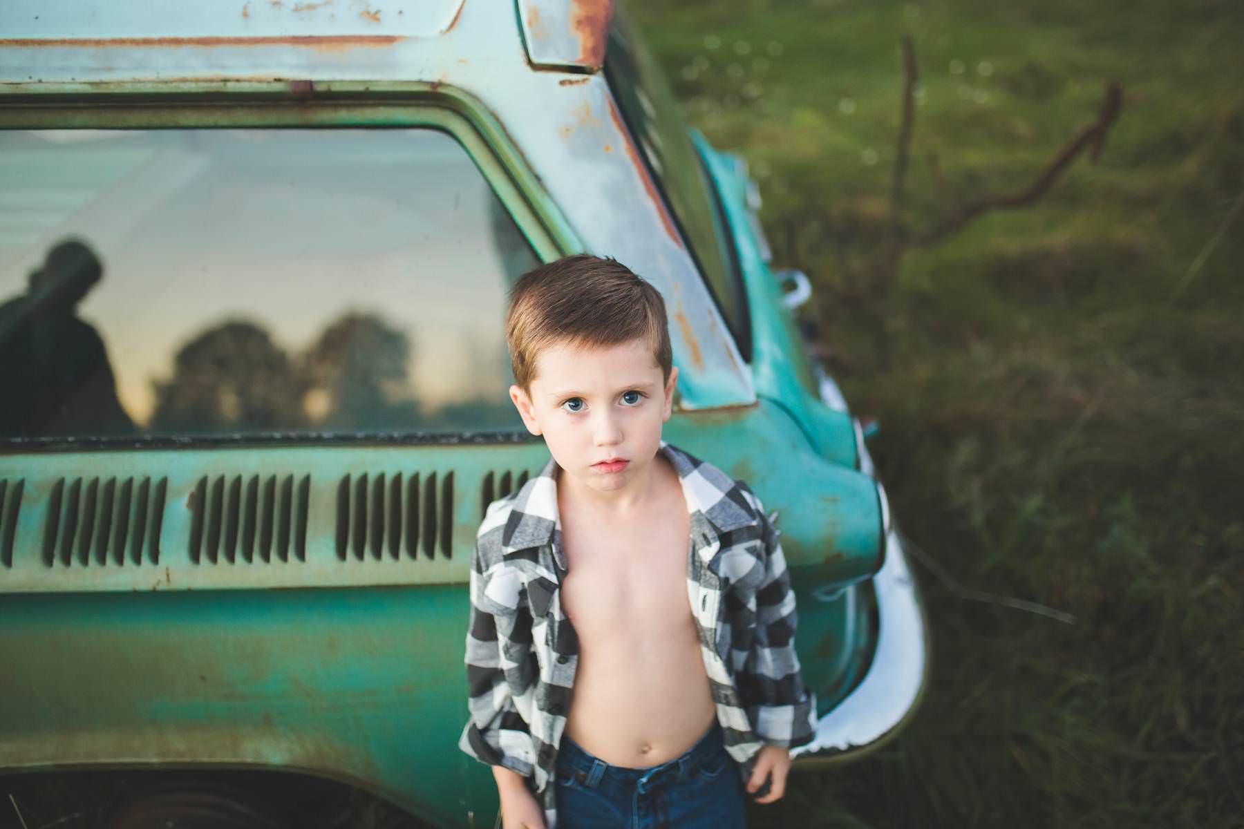 boy-wants his picture taken by classic car