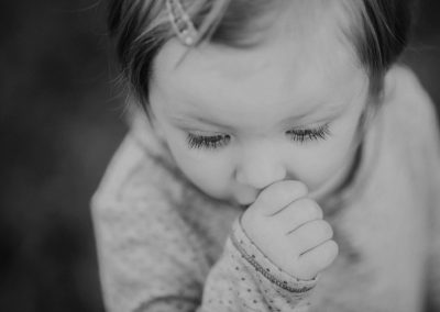 toddler girl sucking her thumb