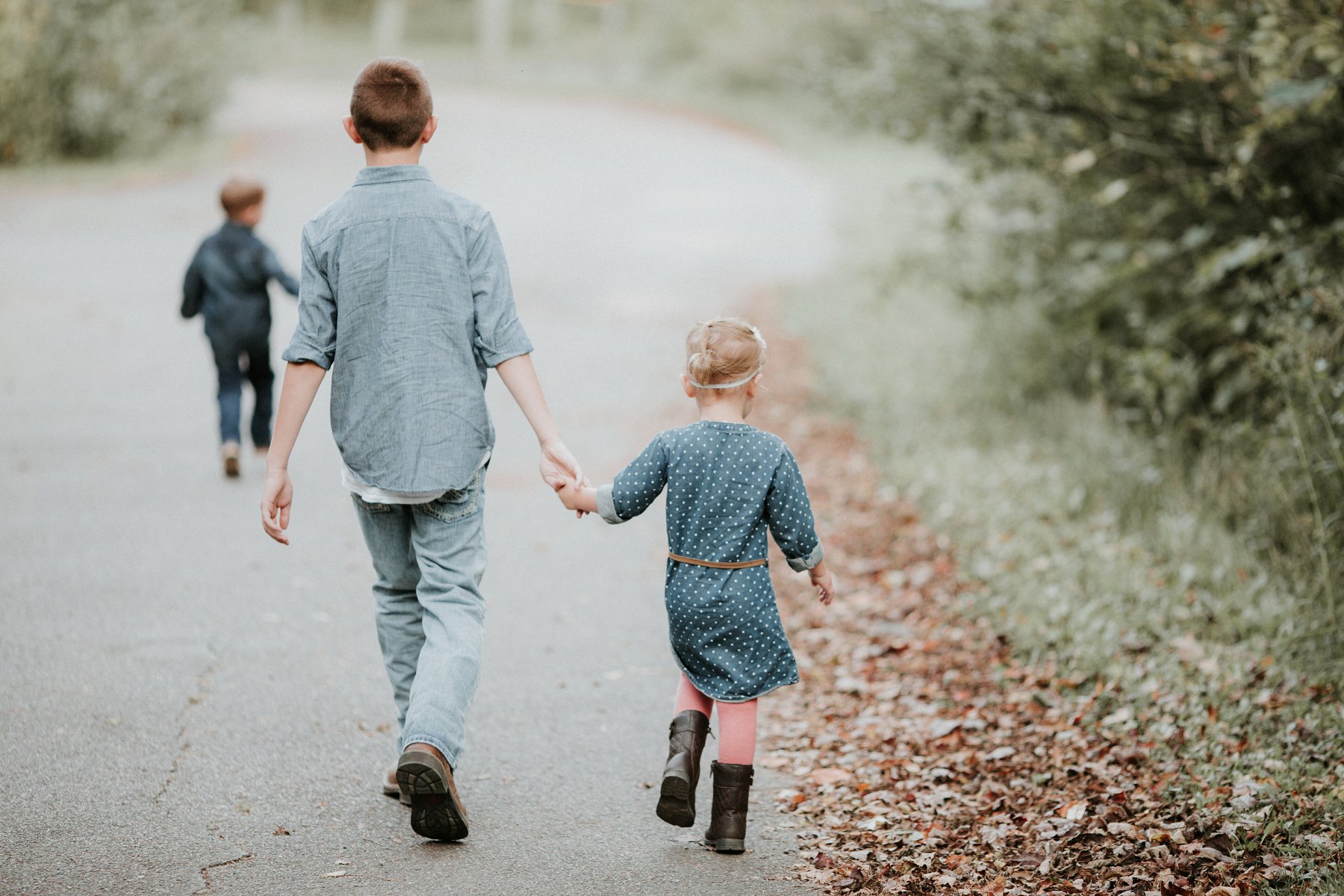 family plays together by river at banning state park