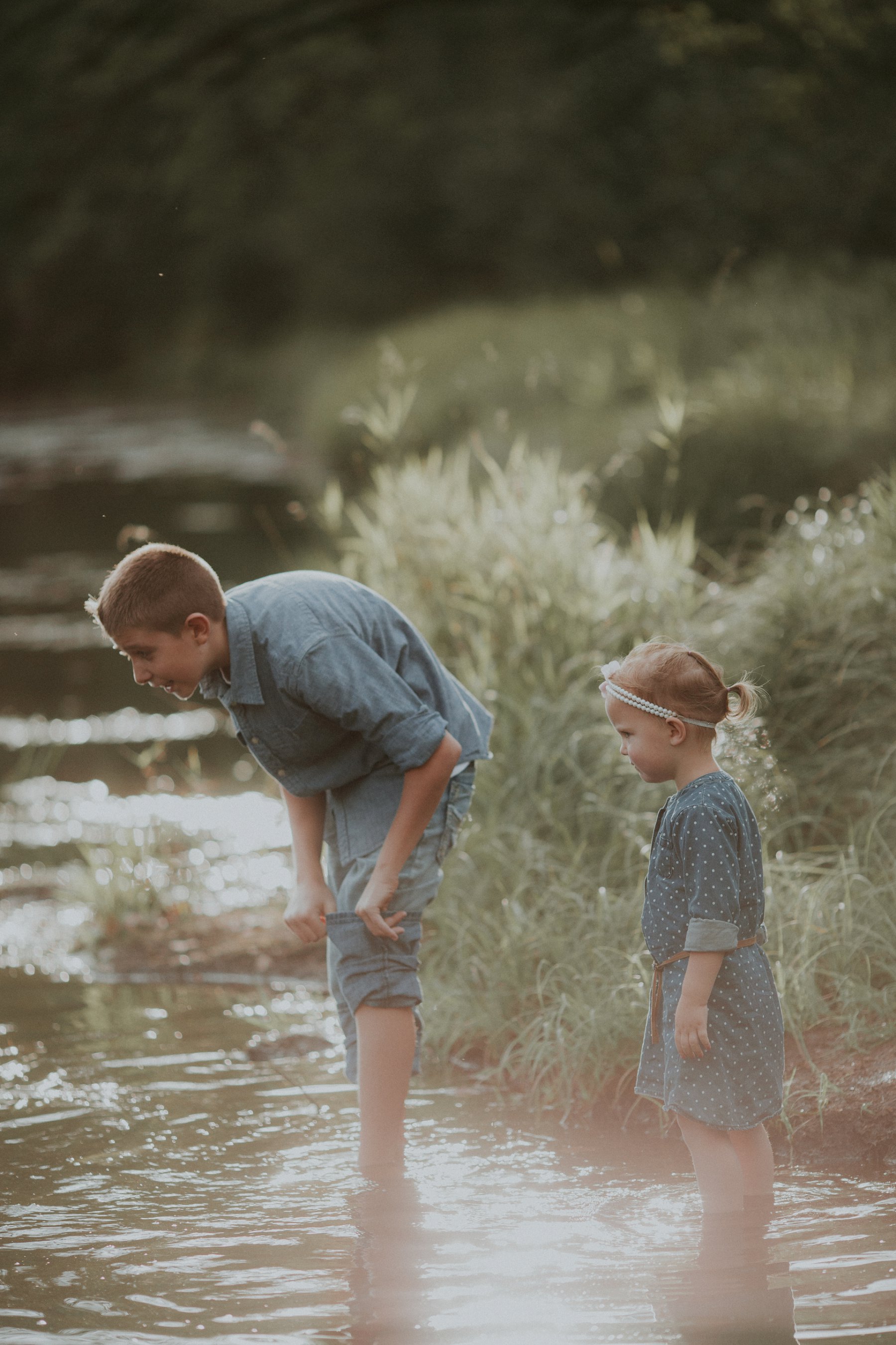 family plays together by river at banning state park