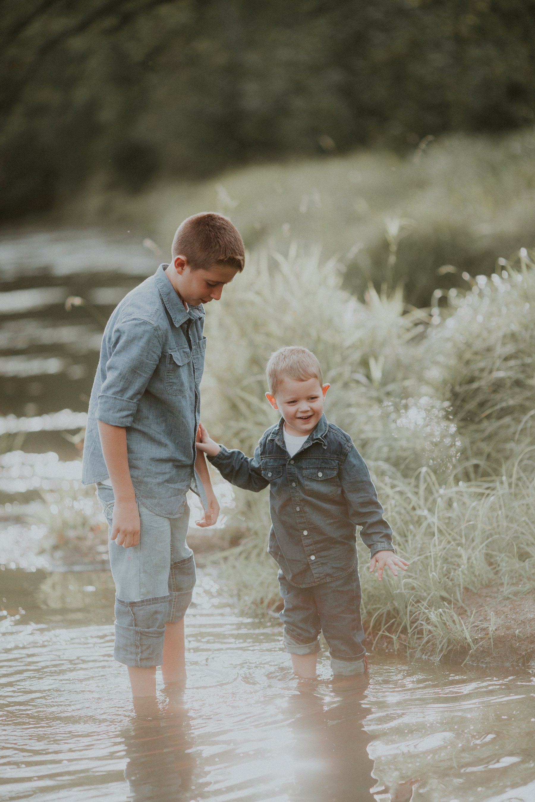 family plays together by river at banning state park