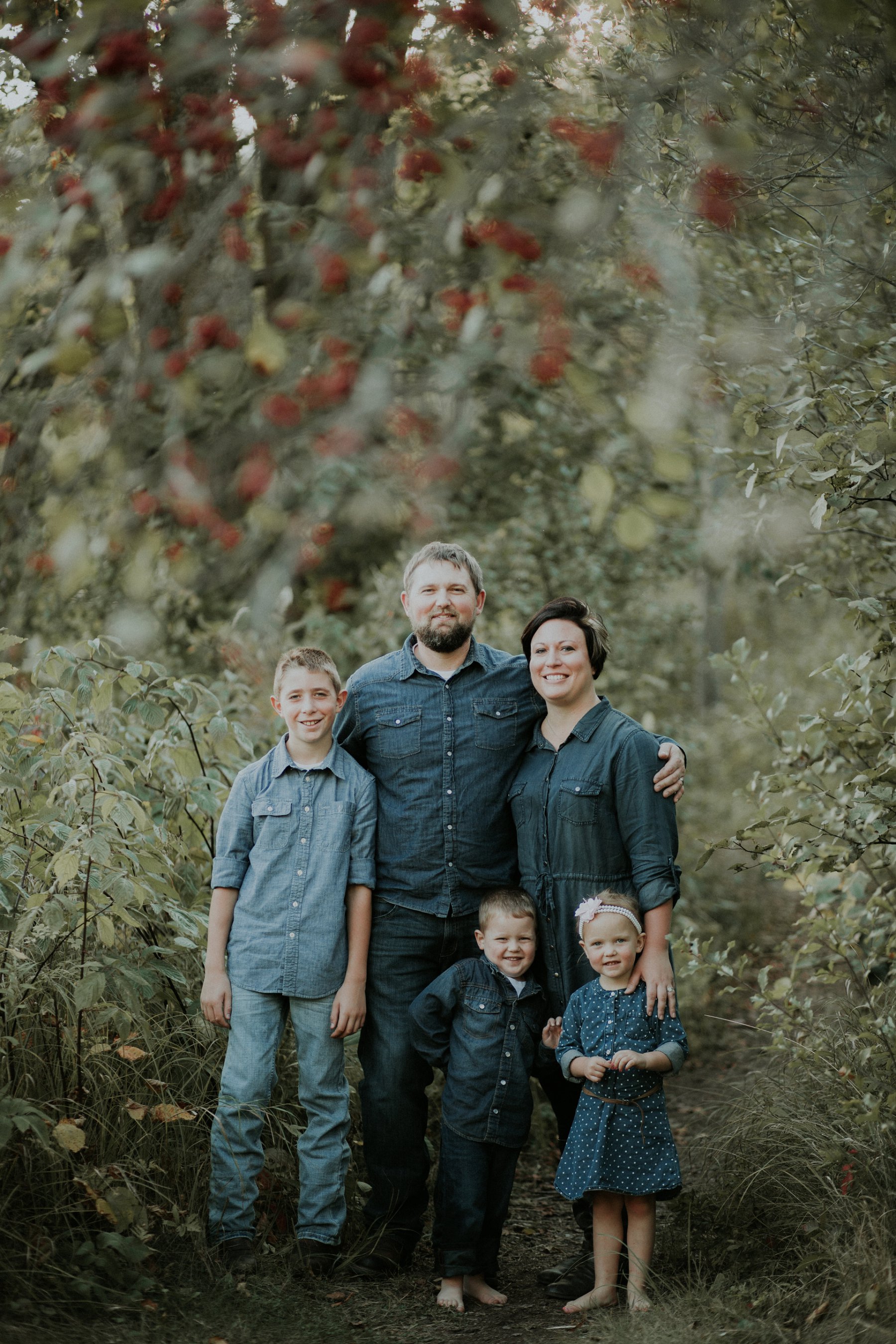 family plays together by river at banning state park